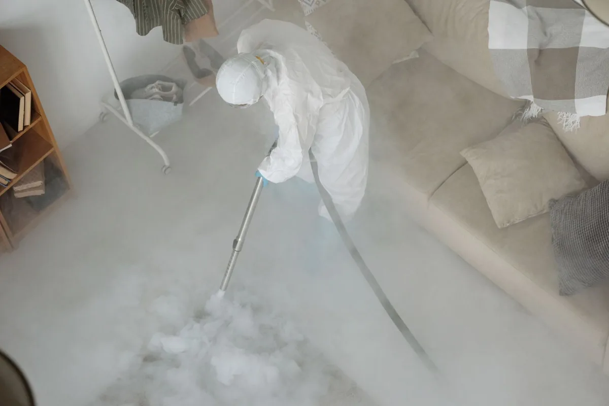 Biohazard cleanup technician in protective equipment, North Miami Beach, FL